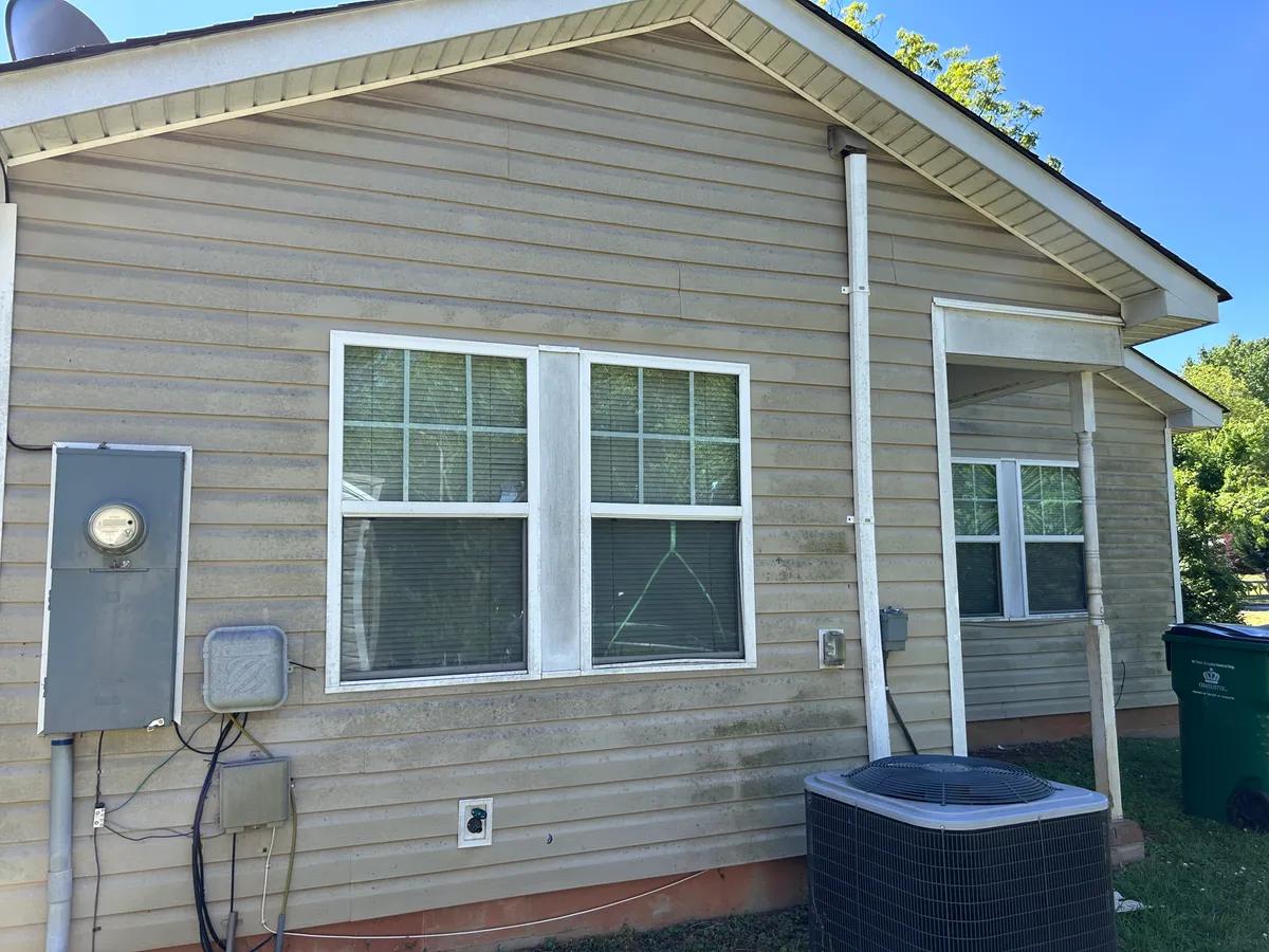 Pressure washing a driveway in Pineville, NC