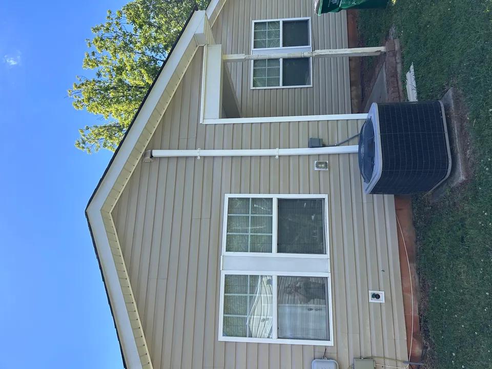 House after soft washing — clean vinyl siding