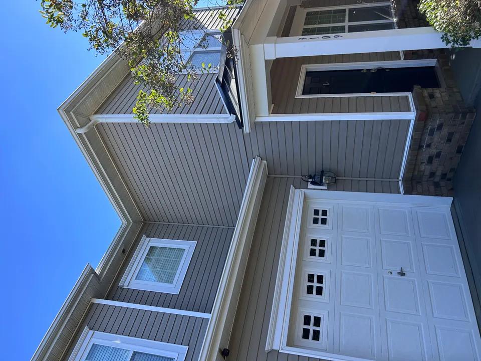 Siding before and after soft washing — algae removal Charlotte NC