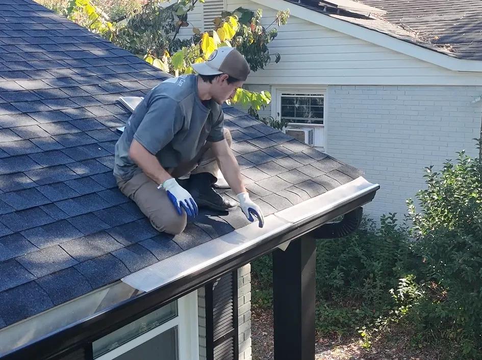 Stainless steel micro-mesh gutter guard installed on a Charlotte home