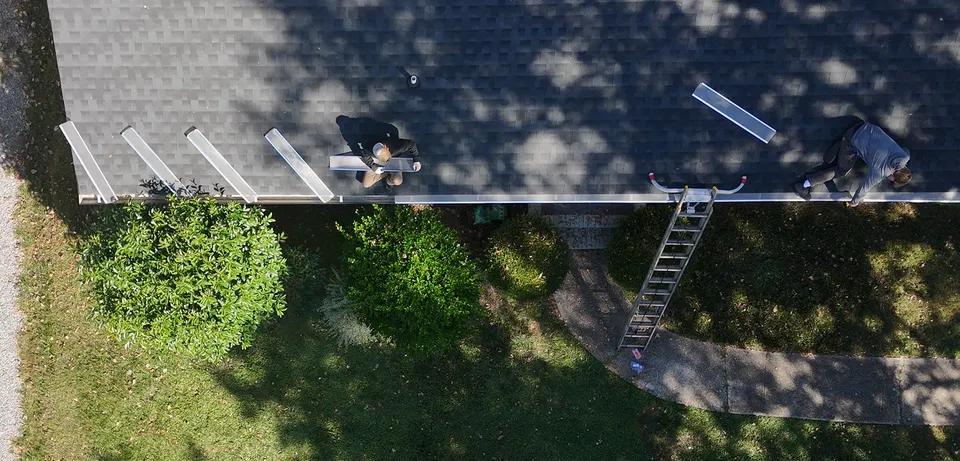 Stainless steel micro-mesh gutter guard installation on a Charlotte home