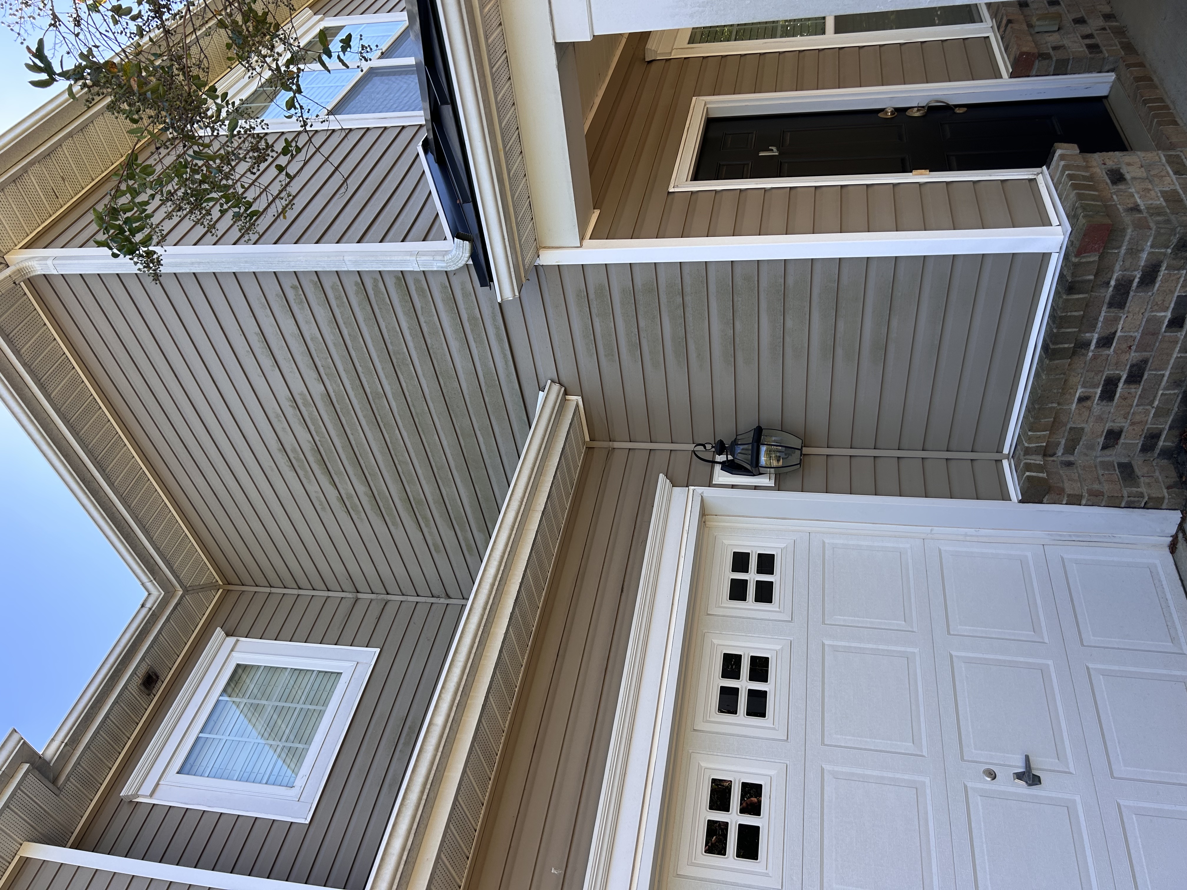 House after soft washing — clean vinyl siding